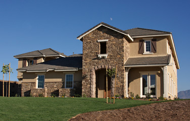 Abstract of newly constructed, modern home facade.