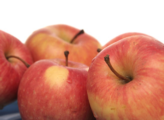 Many red apples on a white background