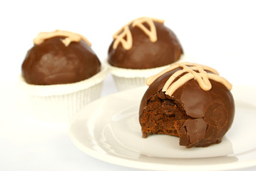 Three brandy balls (one gnawed)