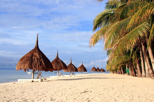 row of nipa hut along the beach