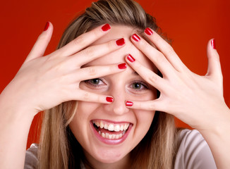 woman with fingers over her face