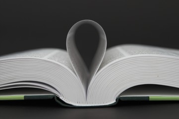 opened book over black background