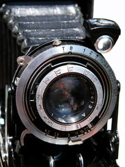 A vintage camera against a bright background