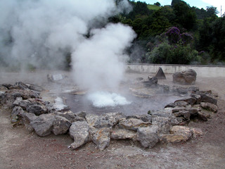 Calm water in geothermal geyser in Azores Islands