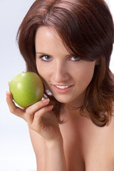Beautiful girl with a green apple 