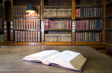 Open book in old ibrary. Part of series