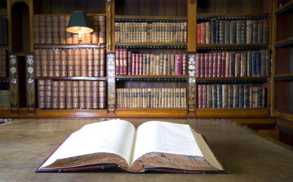 Open book in old ibrary. Part of series