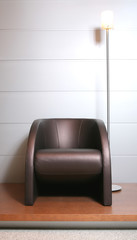 Fototapeta premium trendys leather easy-chair with floor-lamp
