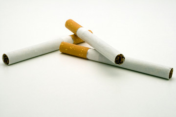 three cigarets on white background