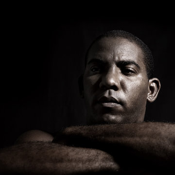 Young Serious Afroamerican Man Isolated On Black