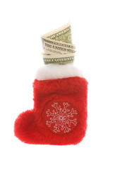 Obraz na płótnie Canvas Red christmas sock with dollar cash money isolated on white