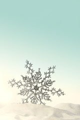 Fototapeta na wymiar Sparkling snowflake in the snow with aqua background