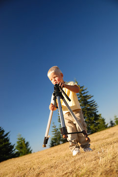 little boy with tripod