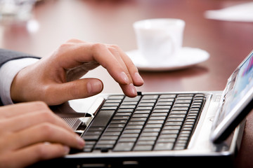 Hand above keyboard