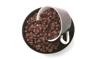 The black cup with fragrant coffee costs on a table
