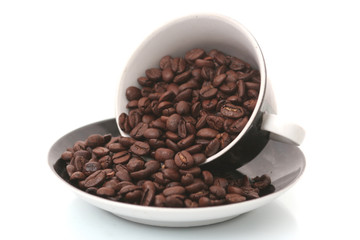 The black cup with fragrant coffee costs on a table