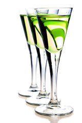 Glasses of green  liqueur