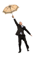 happy flying businessman with umbrella