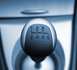 Six speed gear stick toned in blue (shallow DoF)