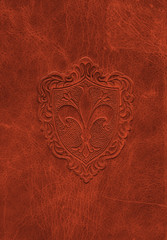 Vintage leather texture with the fleur-de-lis symbol