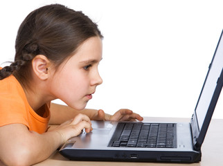 Young girl having fun with computer game