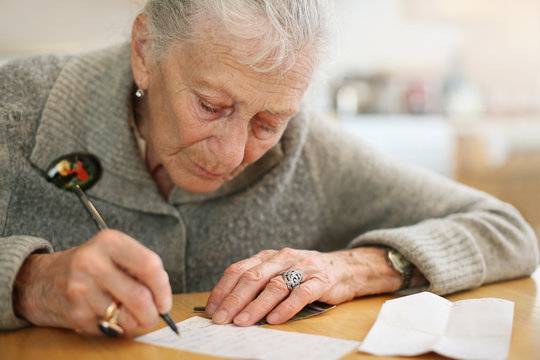 Senior woman writing