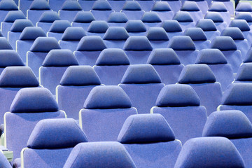 blue chairs in an empty cinema auditorium