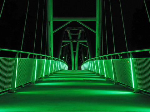 Bridge in the night with green lights