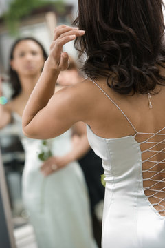 Back of woman in evenging gown.