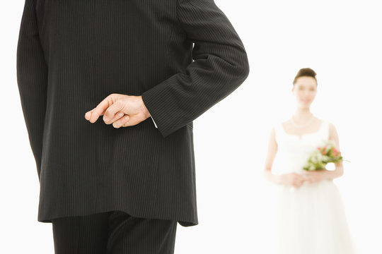 Groom With Crossed Fingers.