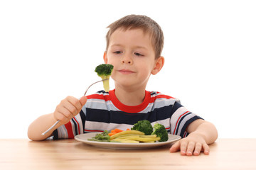 boy and cooked vegetables