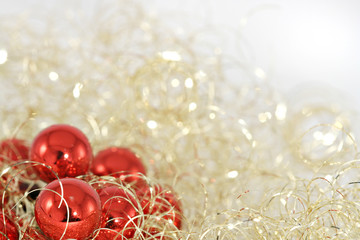 Red christmas balls in golden wool