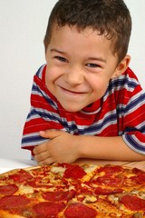 Boy ready to eat a pizza