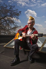 Punk playing guitar.