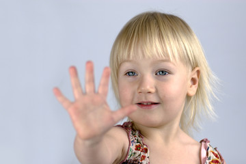 Little girl analyzing her palm
