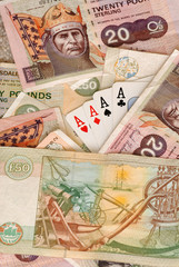 UK Bank notes and four aces.