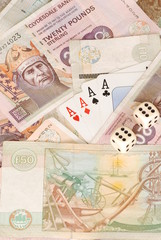 UK Bank notes and four aces and 2 dice