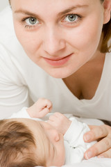 Obraz na płótnie Canvas Loving mother with baby