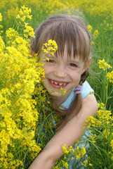 girl at  a field of yellow flowers