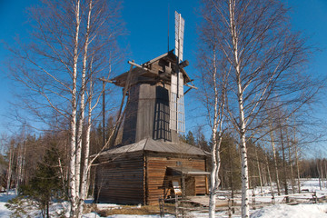 Fototapeta na wymiar Wooden wind mill on north of the Europe