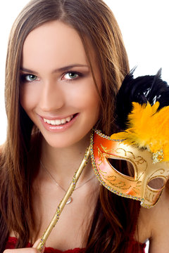 Portrait of beautiful woman wearing gold carnival mask