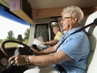 Senior woman driving RV. - 5320374
