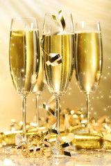 Glasses of golden champagne with stars