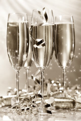 Glasses of golden champagne/ sepia tone