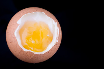 Egg from above on a black background