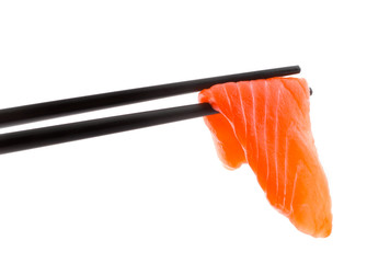 Sushi with chopsticks shot on white.