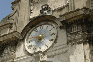 architectural detail of building clock, Spoleto, Italy