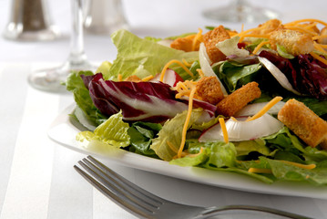 A colorful tossed green salad