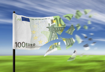 An euro banknote paper money falling into pieces in the wind.