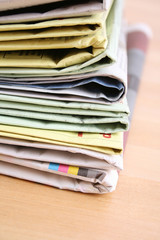 stack of newspapers on the table - close-ups